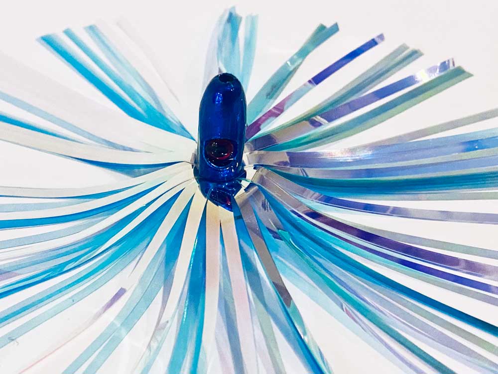 Mylar Duster Lure 4.5" Blue Silver Holographic - close up of 1oz cobalt blue lead head with red eye