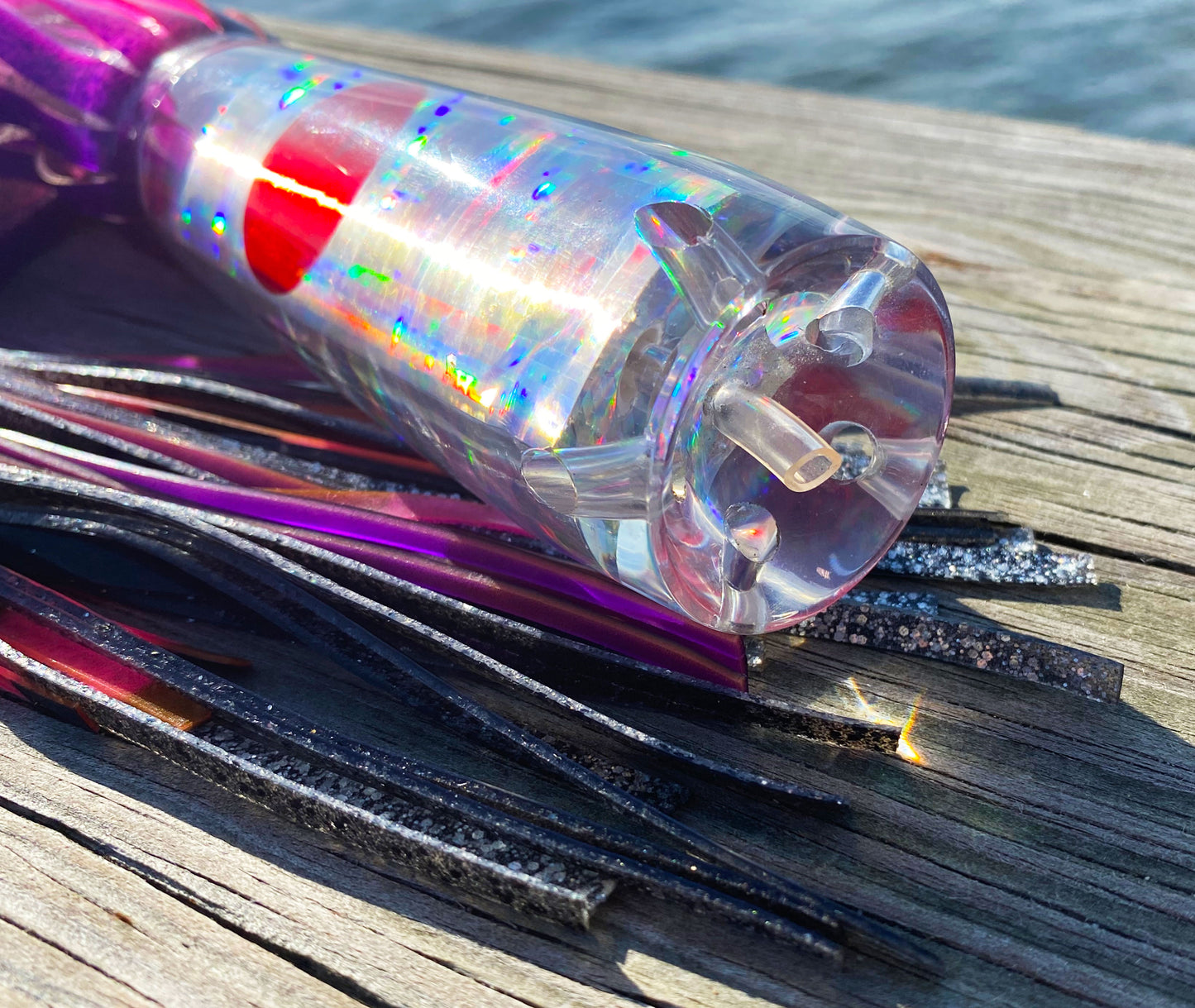 Moon Tide Big Dawg close-up of clear cupped face with 5 jets, holographic silver insert and red mirrored eyes