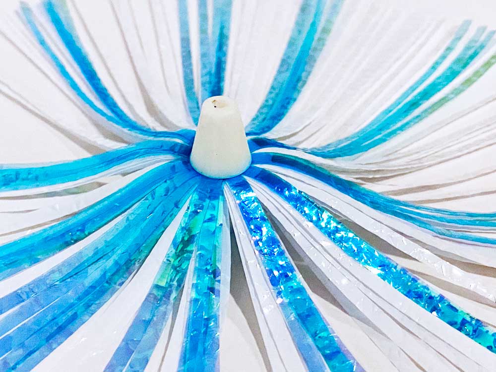 Mylar Duster Lure 4.5" Teal Blue White Crinkle Holographic - close up of white acrylic head