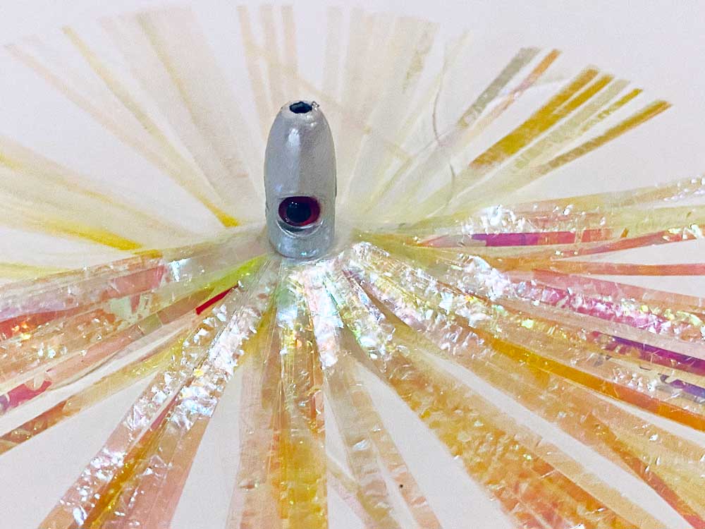 Mylar Duster Lure 4.5" Chartreuse Pearl Crinkle - close up of 1oz white lead head with red eye