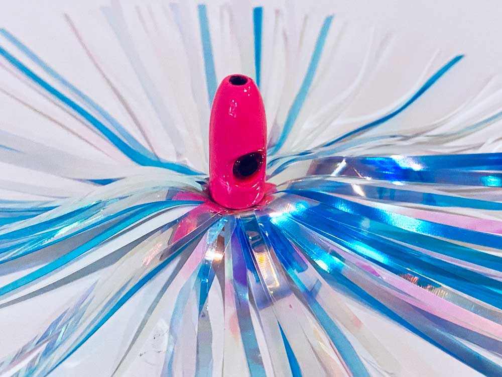 Mylar Duster Lure 4.5" Blue Cotton Candy Holographic - close up of 1oz hot pink lead head with black eye