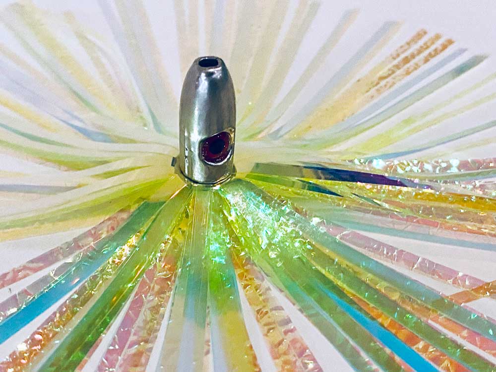 Mylar Duster Lure 4.5" Bright Yellow Gold Crinkle - close up of 1oz silver lead head with red eye