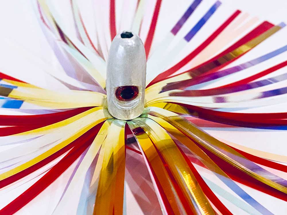 Mylar Duster Lure 4.5" Gold Holographic Red Crinkle - close up of 1oz silver lead head with red eye