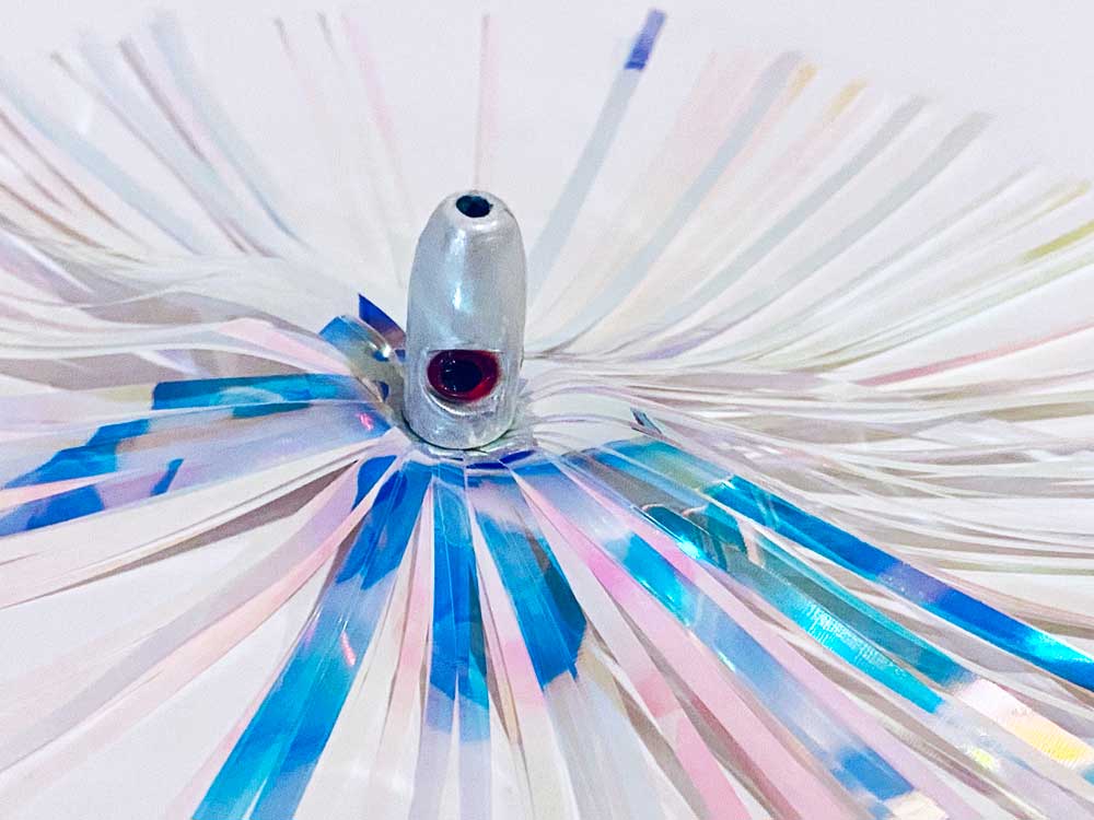 Mylar Duster Lure 4.5" Cotton Candy White Holographic - close up of 1oz silver lead head with red eye and iridescent cotton candy strands