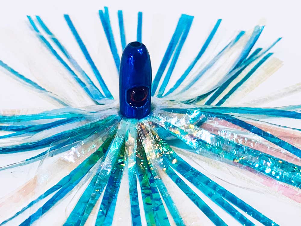 Mylar Duster Lure 4.5" Teal Cyan Pearl Crinkle - close up of 1oz royal blue lead head with red eye