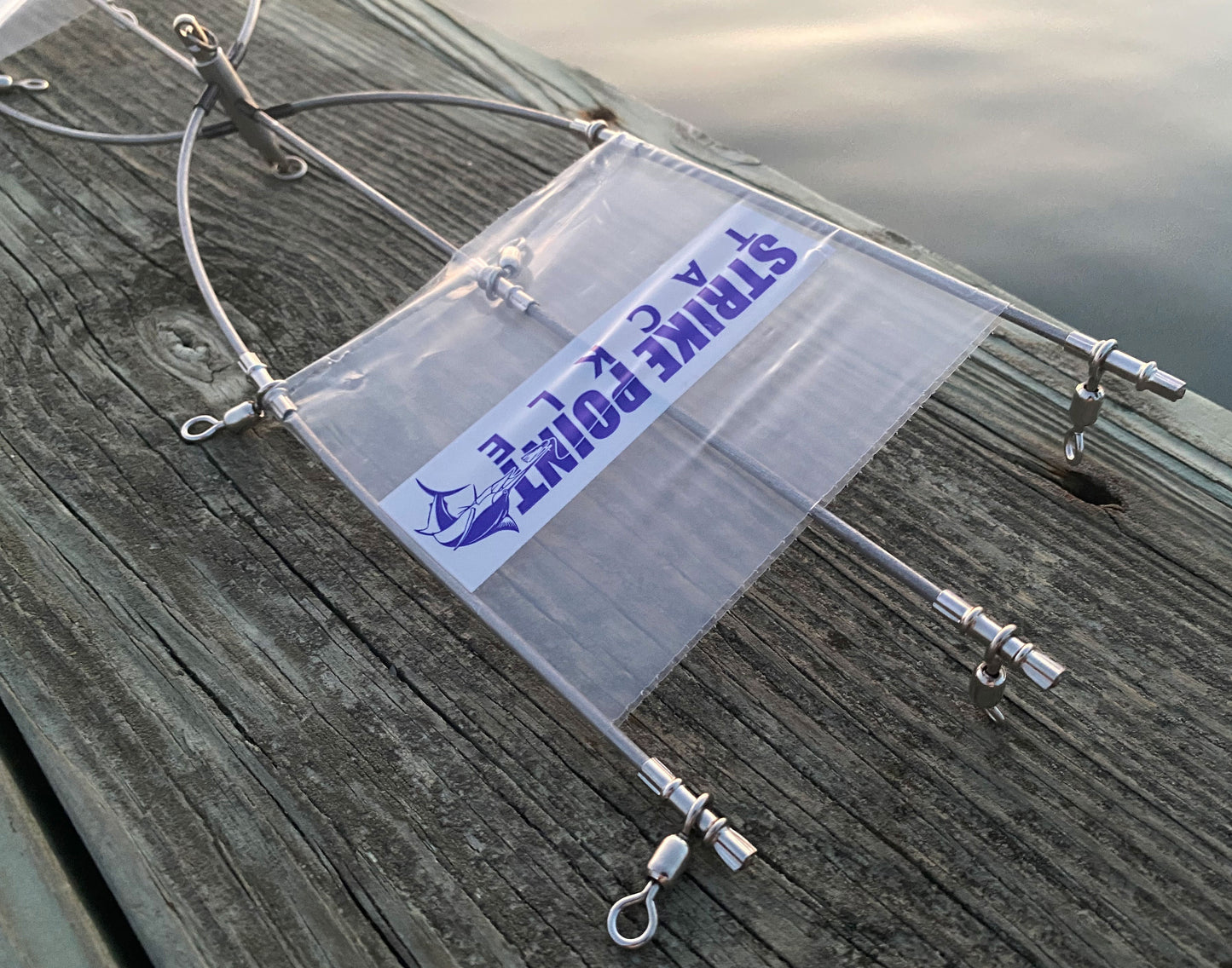 24 inch stainless steel dredge bar with 13 drops - single bar close up on dock