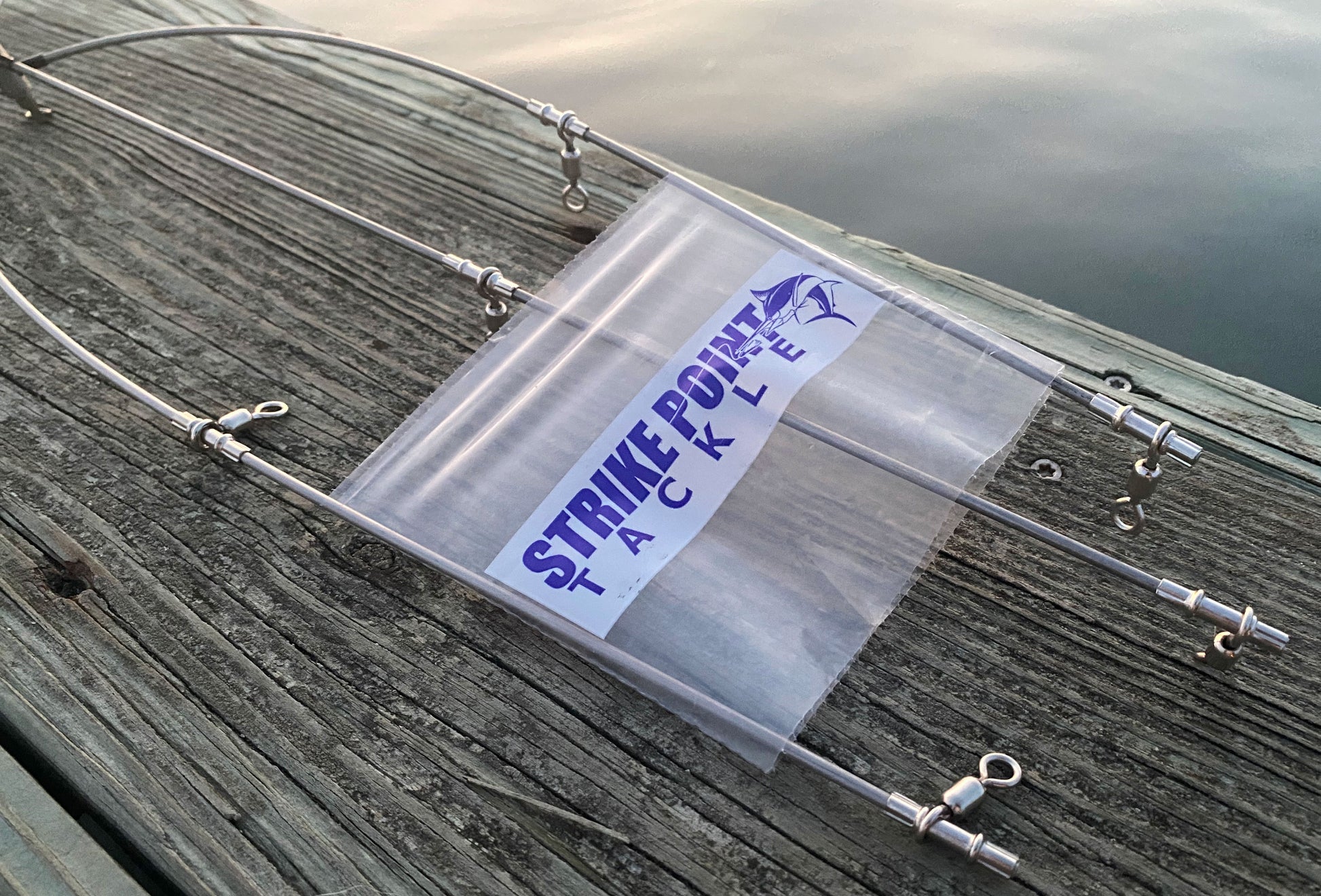 36 inch stainless steel dredge bar with 13 drops - single bar close up on dock