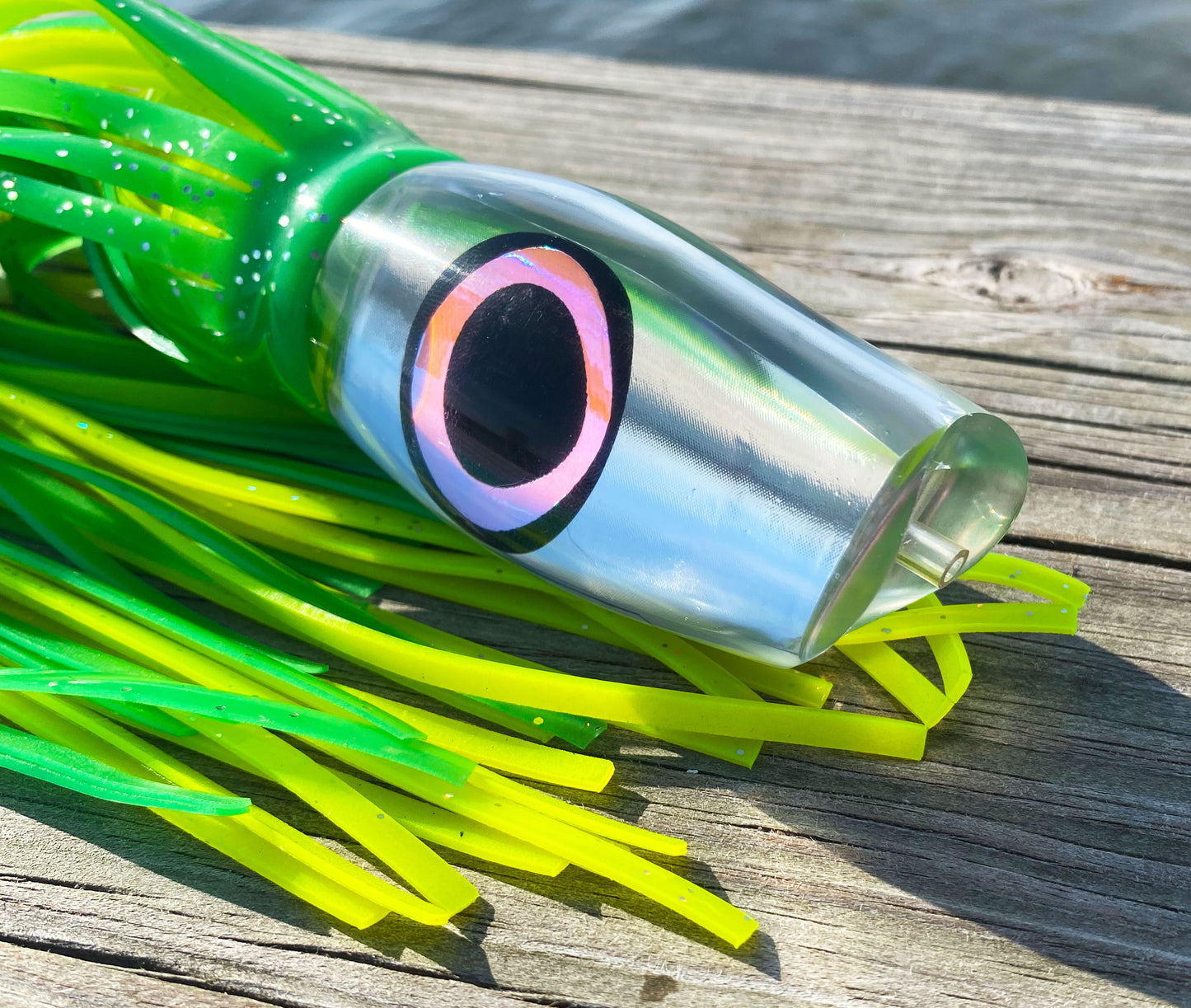 Moon Tide Marlin Seeker Green/Chartreuse close-up of clear head with mirrored insert and mirror black/pink eyes