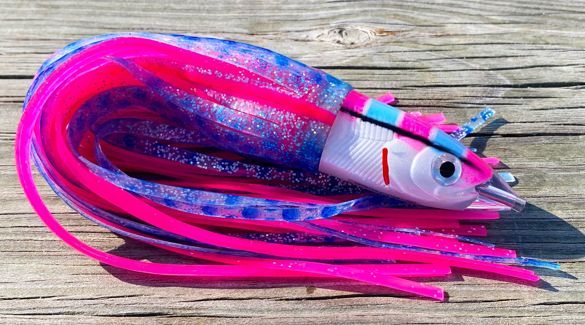 Moon Tide Dart Magic Pink/Blue/White big game trolling lure - smooth bullet head with blue/silver/pink and solid pink double skirts