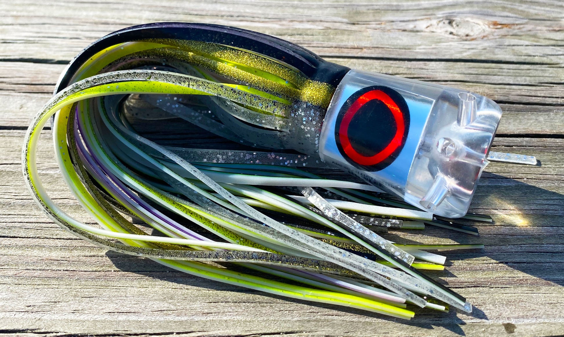 Moon Tide Jet Howler big game trolling lure - clear mirrored head with black/silver and purple/yellow double skirts