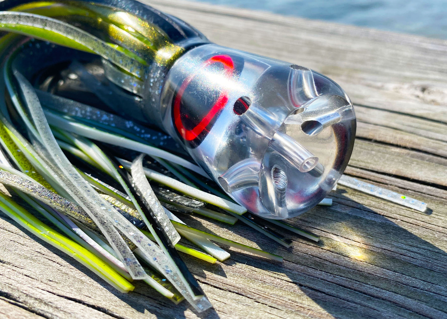Moon Tide Jet Howler close-up of clear mirrored cupped face with 5 jets and red/black mirrored eyes