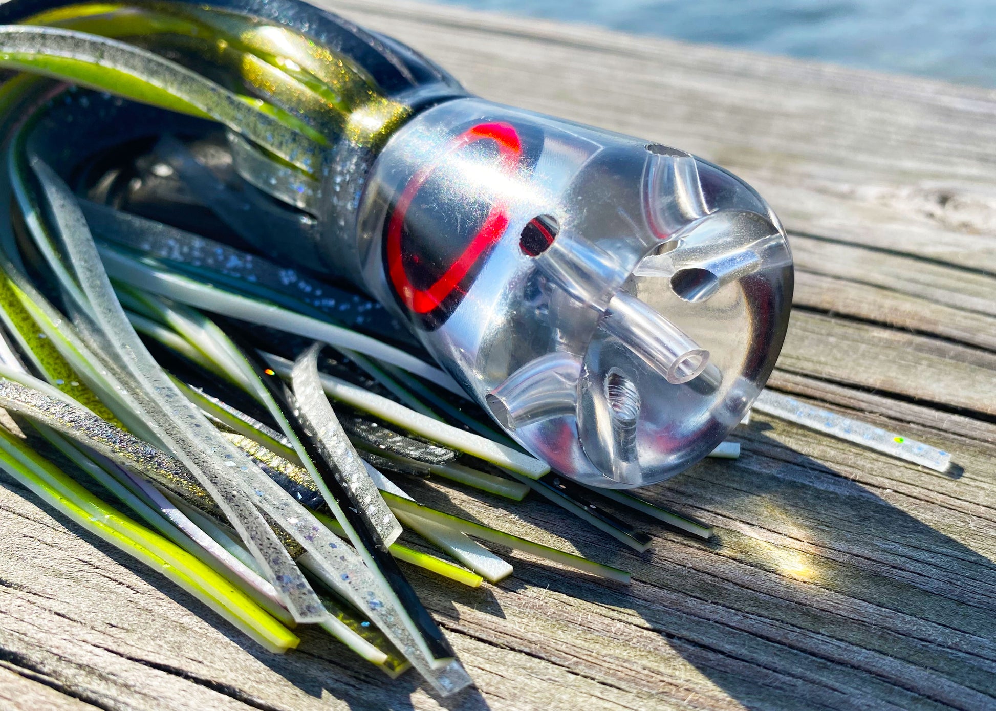 Moon Tide Jet Howler close-up of clear mirrored cupped face with 5 jets and red/black mirrored eyes