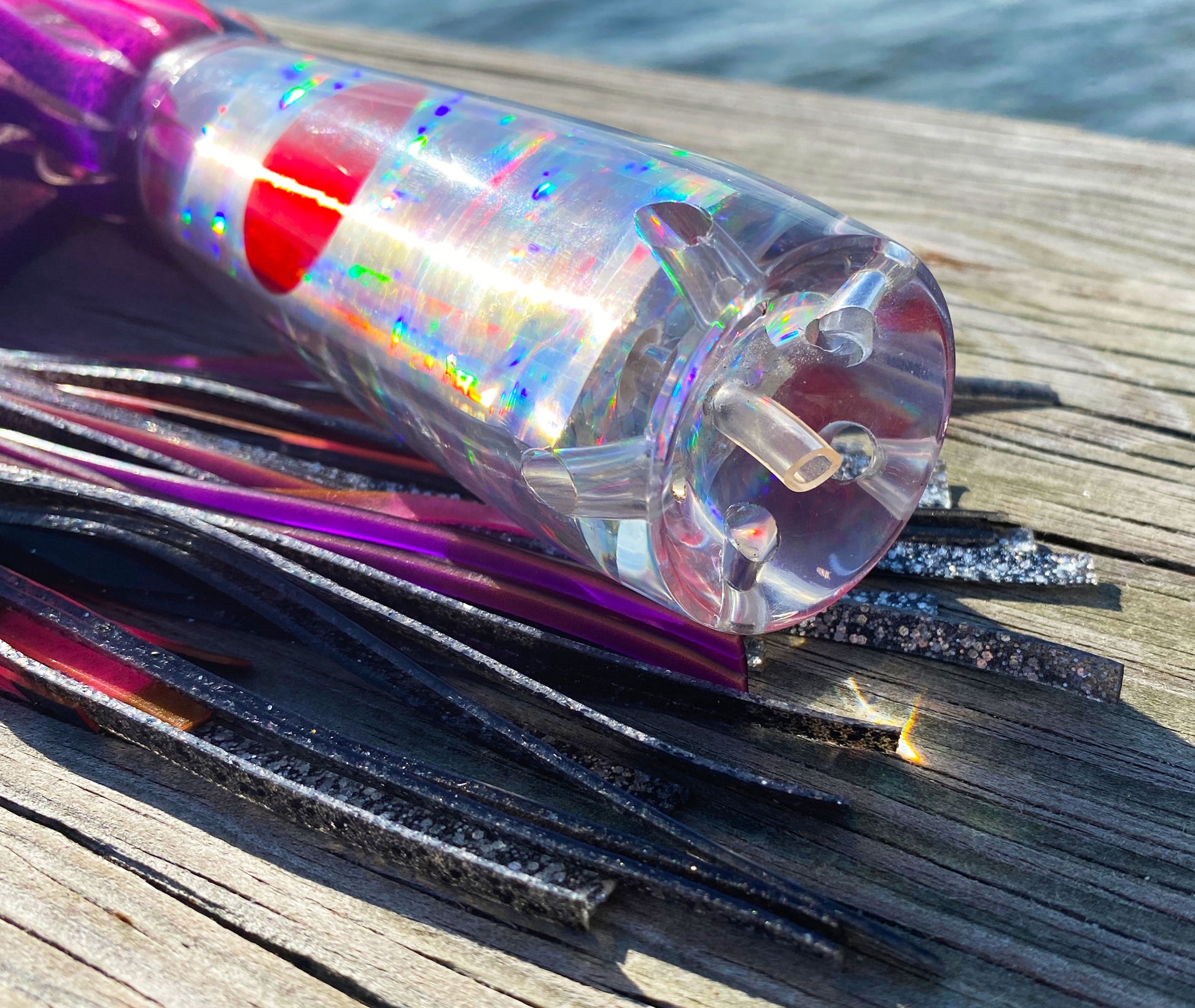 Moon Tide Big Dawg close-up of clear cupped face with 5 jets, holographic silver insert and red mirrored eyes