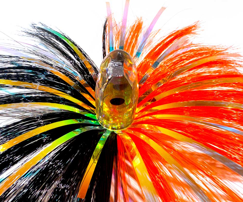 Close-up of the 3oz HooSkull crystal mirror head with black/orange witch hair and mylar flash